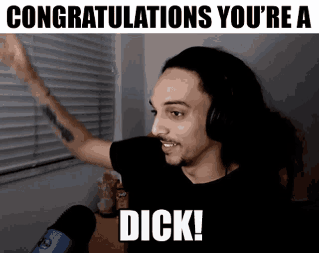 a man wearing headphones says congratulations you 're a dick in front of a window