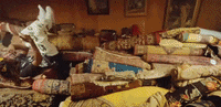 a person is laying on a bed with a pile of blankets