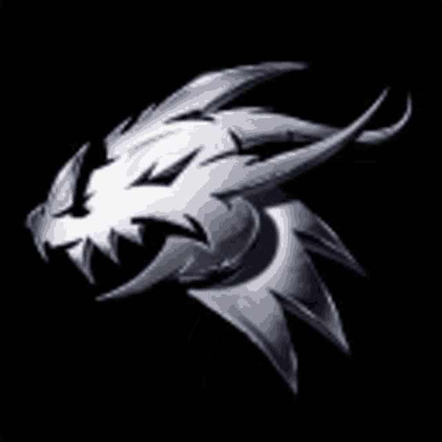 a silver dragon head with sharp teeth is on a black background .