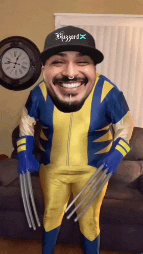 a man in a wolverine costume is wearing a hat that says blizzard on it