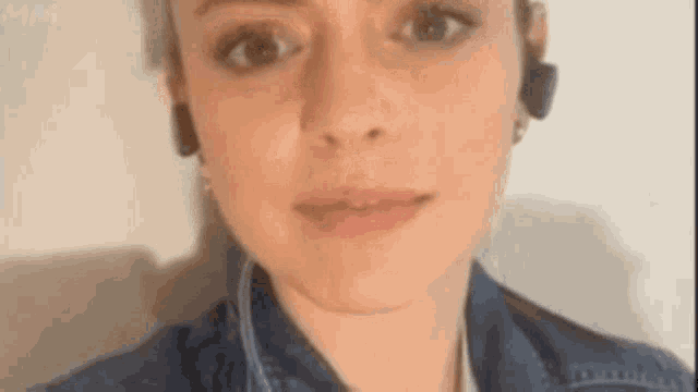 a close up of a woman wearing headphones .