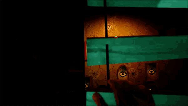 a person is playing a video game with a cartoon character on the wall
