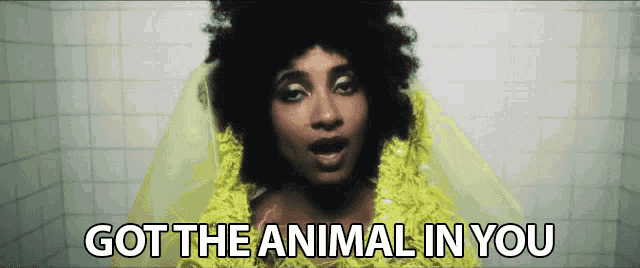 a woman in a yellow dress with the words got the animal in you below her