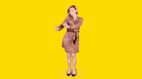 a woman in a dress with a tie around her waist