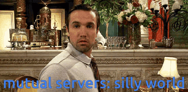 a man is standing in front of a bar with the words mutual servers silly world written on the bottom