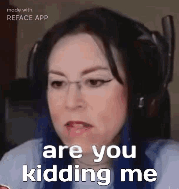 a woman with blue hair is wearing headphones and says " are you kidding me "