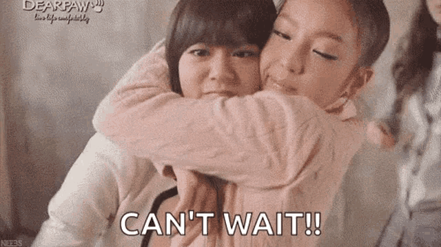 two girls hugging each other with the words `` can t wait '' written on the bottom .
