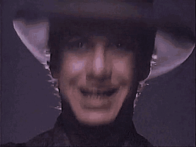 a close up of a person wearing a helmet smiling .