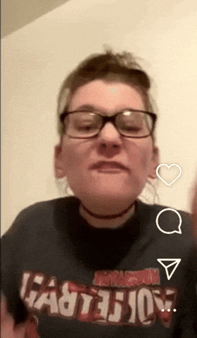 a woman wearing glasses and a black shirt that says ' fasterjoy '