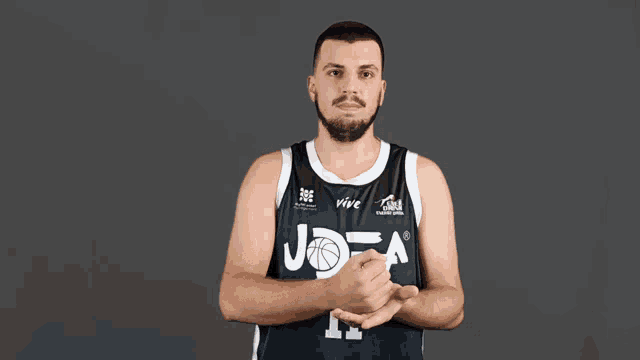 a basketball player wearing a jersey that says jota