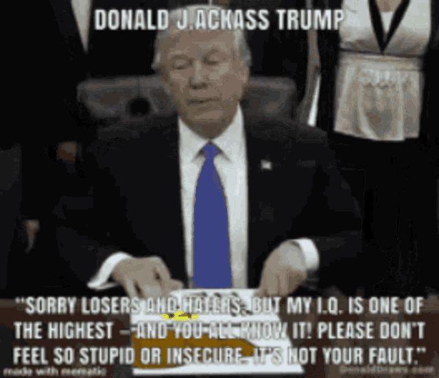 donald j. ackass trump is sitting at a table with a piece of paper