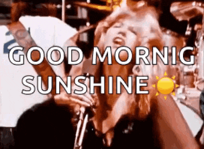a woman is singing into a microphone with the words `` good morning sunshine '' written above her .