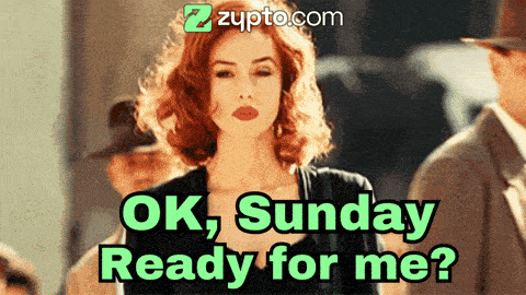 a woman with red hair is standing in front of a sign that says ok sunday ready for me