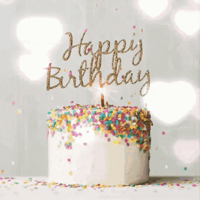 a birthday cake with sprinkles and a candle says happy birthday