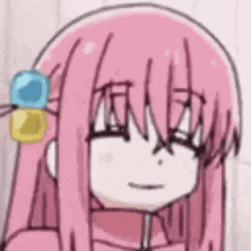 a close up of a cartoon girl with pink hair .