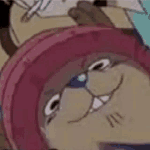 a close up of a cartoon character wearing a pink hat .