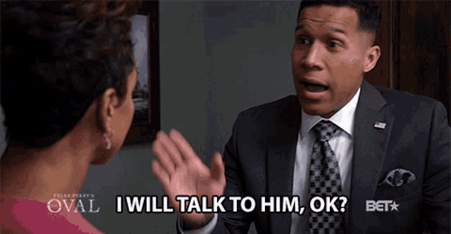 a man in a suit and tie is talking to a woman with the words i will talk to him ok