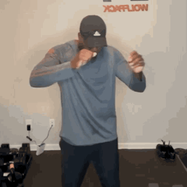 a man is standing in front of a wall that says xtremeflow