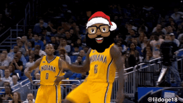 two indiana basketball players wearing santa hats are dancing on the court