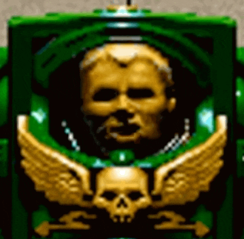 a green robot with a gold skull and wings on it 's chest .