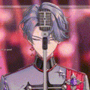 a man is standing in front of a microphone with his eyes closed .