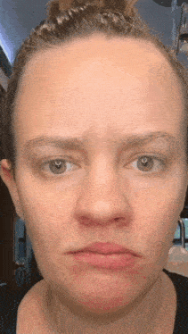 a close up of a woman 's face without makeup
