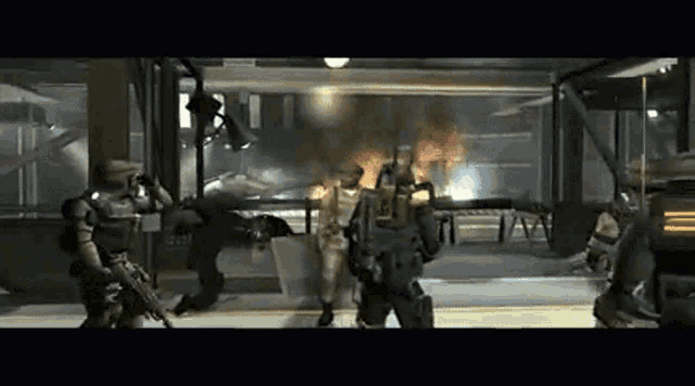 a group of soldiers are standing in a room with a fire in the background ..