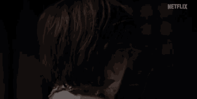 a close up of a man 's face with a netflix logo in the background