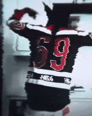 a person wearing a jersey with the number 69 on the back