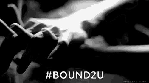 a black and white photo of a person holding another person 's hand with the words `` bound2u '' .