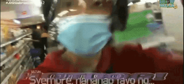 a person wearing a mask in a store with the words " svemore mananap tayo ng "