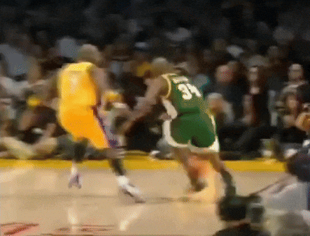 a basketball player with the number 34 on his back dribbles the ball