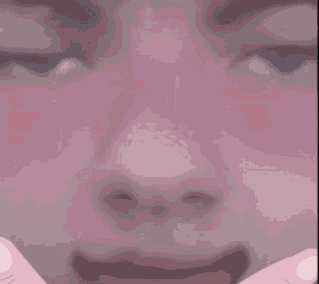 a woman 's face is surrounded by red hearts and the word hey is visible