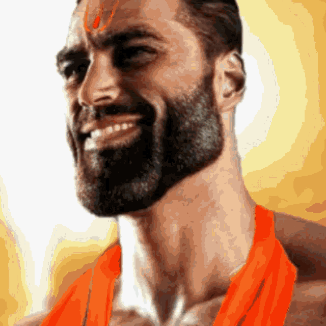 a man with a beard and an orange shirt is smiling