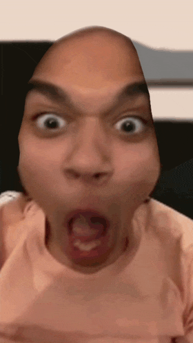a close up of a man making a funny face