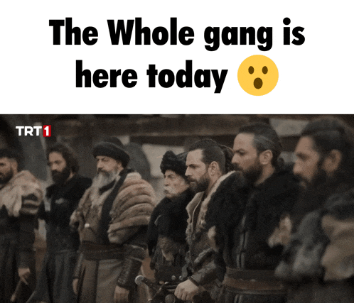 a group of men are standing in a line with the words the whole gang is here today