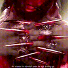 a close up of a person 's face with sharp nails