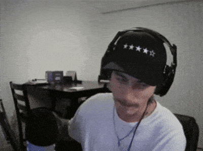 a man wearing headphones and a hat with five stars