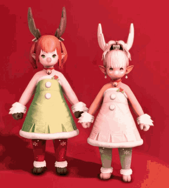 two little girls dressed in christmas costumes are posing for a photo