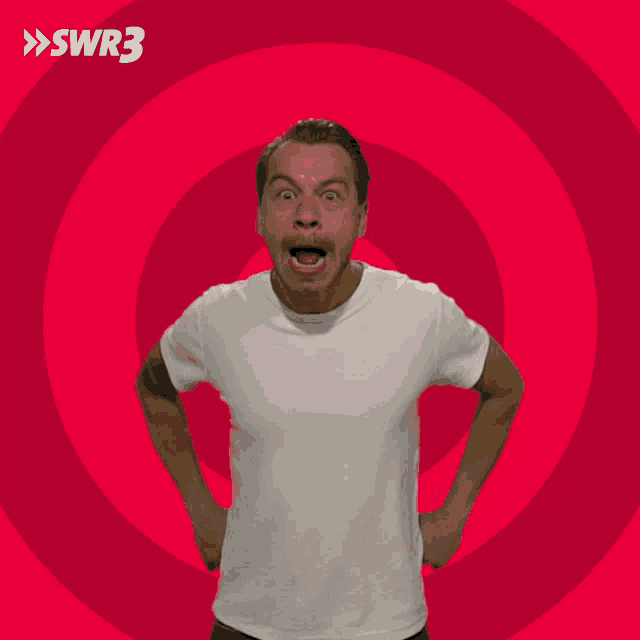 a man is making a funny face in front of a red circle with swr3 on it