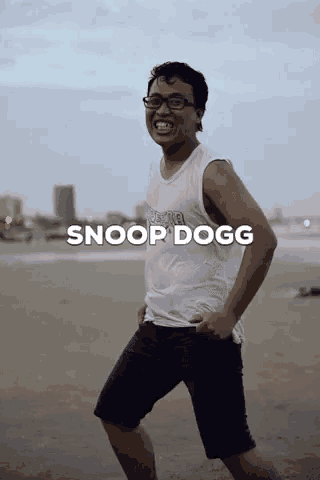 a man standing on a beach with the words snoop dogg written above him