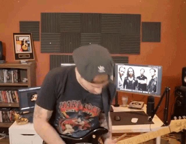 a man wearing a shirt that says hard rock on it