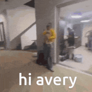 a blurry picture of a person standing in a hallway with the words hi avery written on the bottom