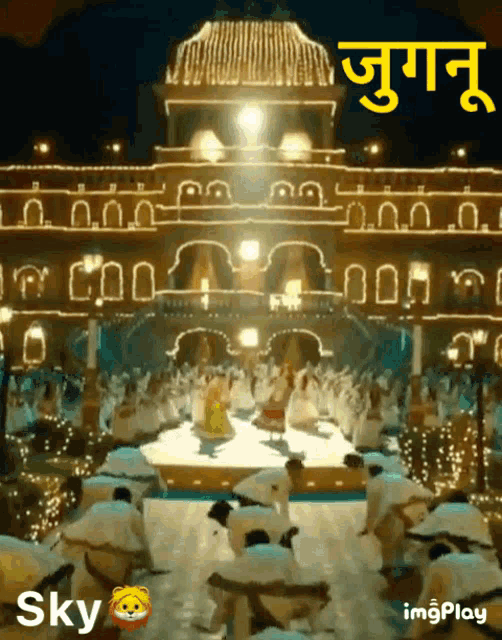 a group of people are dancing in front of a building with the word sky on the bottom