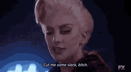 a close up of a woman 's face with the words `` cut me some slack , bitch '' .