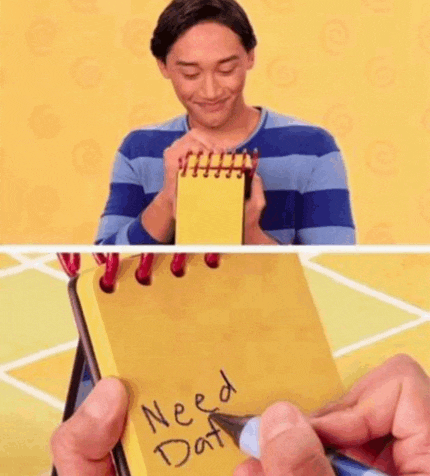 a man is holding a yellow notebook that says need dat on it