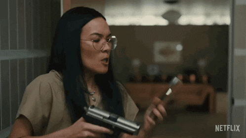 Pointing A Gun On The Phone Amy Lau GIF - Pointing A Gun On The Phone Amy Lau Ali Wong GIFs