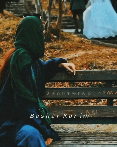 a woman sits on a bench with the name bashar karim written on the bottom