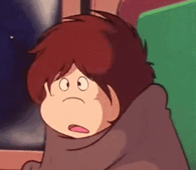 a close up of a cartoon character wrapped in a blanket .