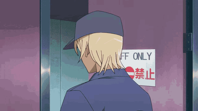 a man in a blue hat stands in front of a sign that says off only